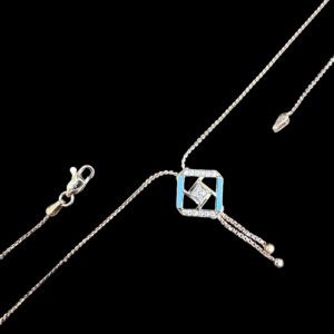 Elegant Turquoise & Diamond Geometric Tassel Necklace